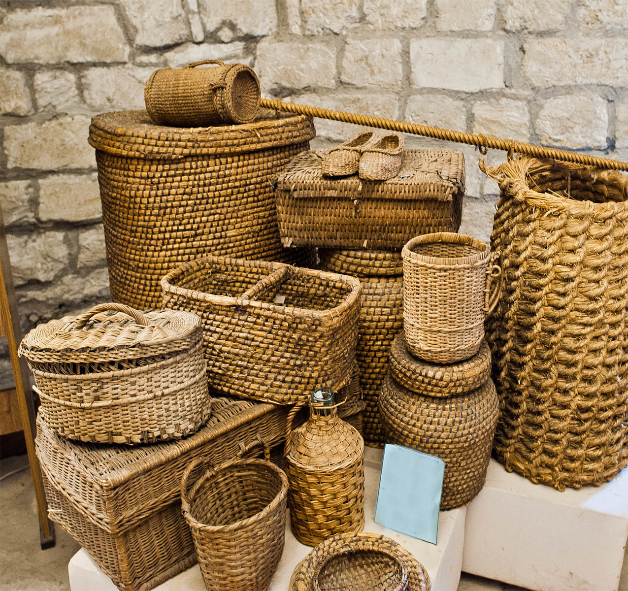 A lot of handmade wickerworks at an exhibition in the museum.